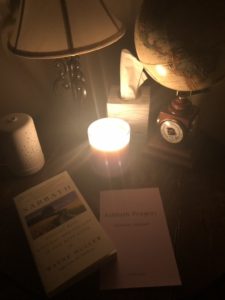 Sabbath Candle on a table with a book on Sabbath and a Sabbath Prayer